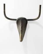 In picasso's masterpiece bull's head, which bicycle part makes up the bull's horns?  o a chain ob. h