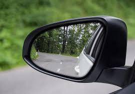 Drive education  when leaning out while adjusting your mirrors, the side of your vehicle should be