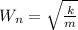 W_n = \sqrt { \frac{k}{m}}
