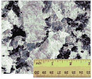 The image below shows a close-up of the crystals formed in a pegmatitic rock. Which characteristic